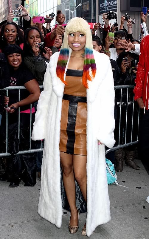 At her MAC launch, Nicki rocked a white mink coat with rainbow tresses and a 