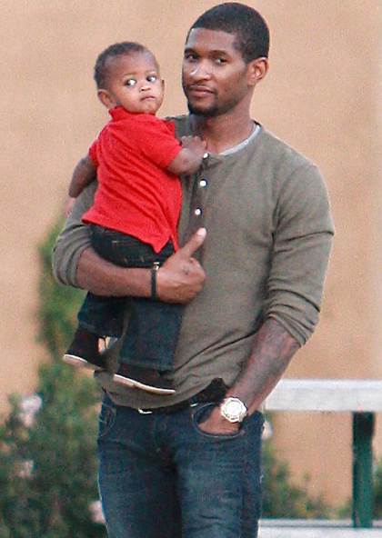 usher with his baby